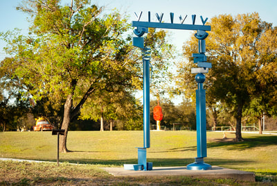Blue portal sculpture in park