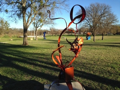 Orange sculpture in park